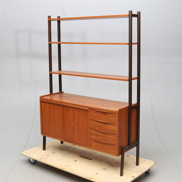TEAK BOOK SHELF WITH 2 DOORS AND 4 DRAWERS, 1960s.