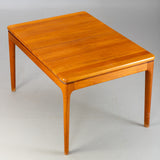 Extendable solid teak rectangular dining table with 2 self stored solid teak leaves, architect-Niels Bach