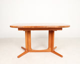 2392012. Glostrup, extendable solid teak dining table, with 2 leaves, Denmark, 1970s.