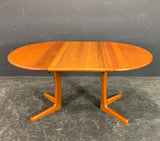 SOLID TEAK EXTENDABLE DINING TABLE.