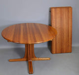 Solid teak Dining table with 2 leaves, and 6 solid teak chairs by Dyrlund