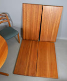 Solid teak Dining table with 2 leaves, and 6 solid teak chairs by Dyrlund